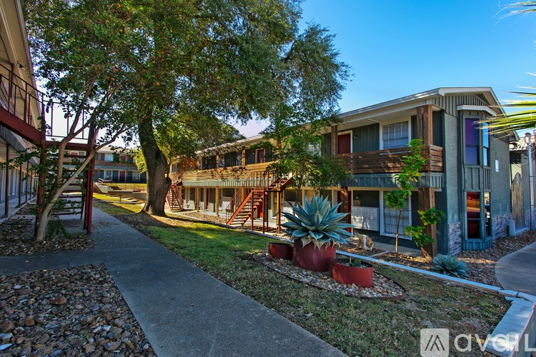 A modern house with a tree in front.