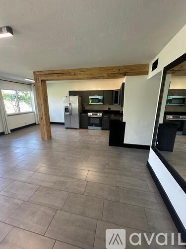 A kitchen area with a counter and cabinets.
