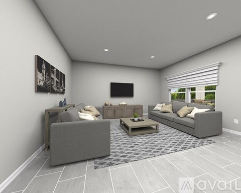 A modern living room with a grey sofa set and a coffee table.