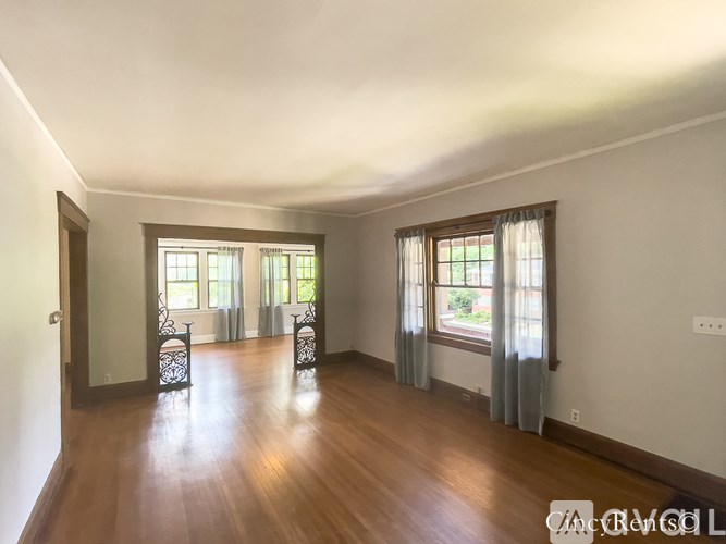 A room with wooden floors and white walls.