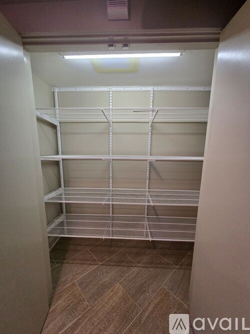 Empty white shelving unit in a room.
