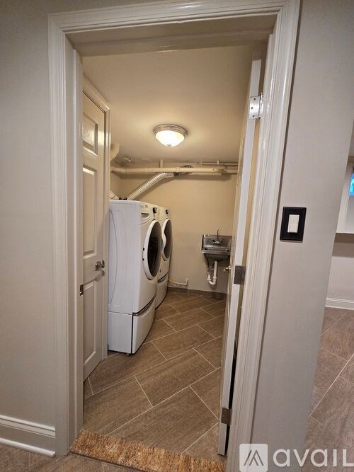 A laundry room with a washer and dryer.