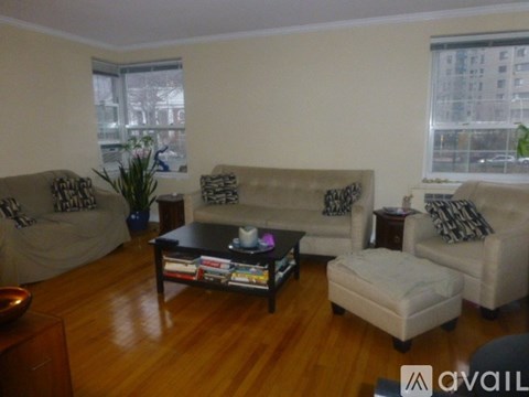 A living room with a couch, chair, and coffee table.