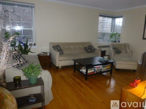 A living room with a couch, chair, and coffee table.