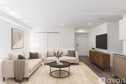 A room with wooden floors and white walls.