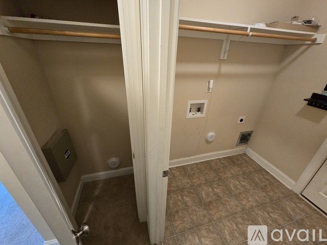 A small bedroom with a bunk bed and a closet.
