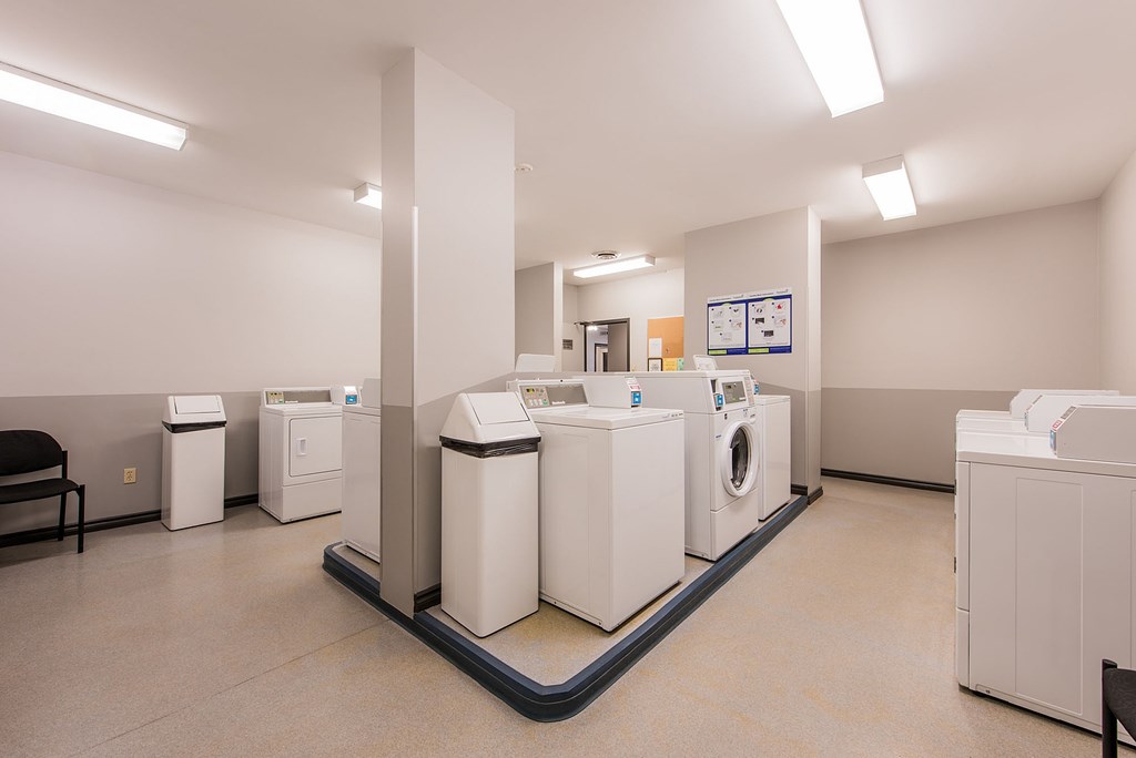 A laundry room with a washer and dryer in it.