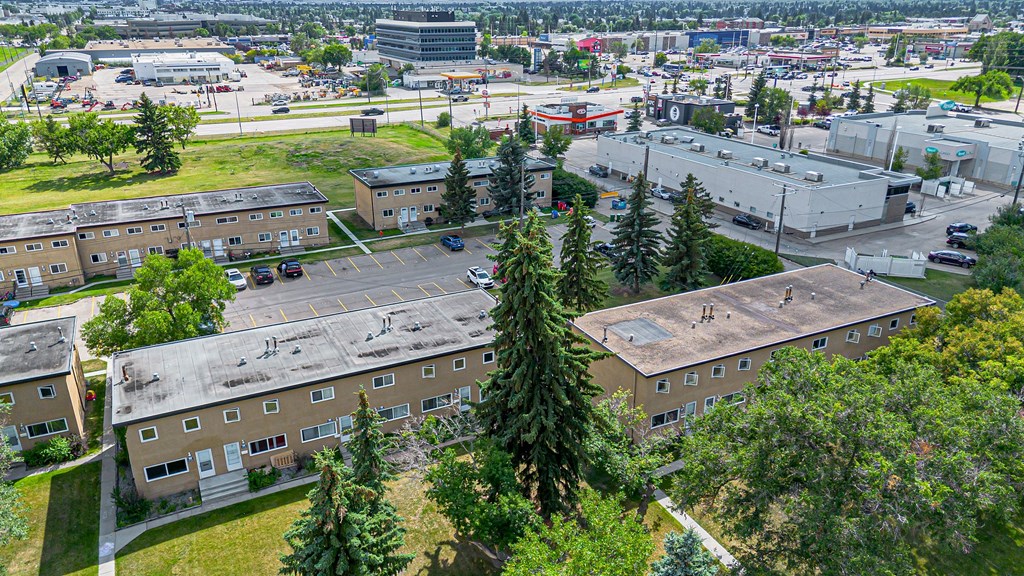 A view of a campus with buildings and trees.