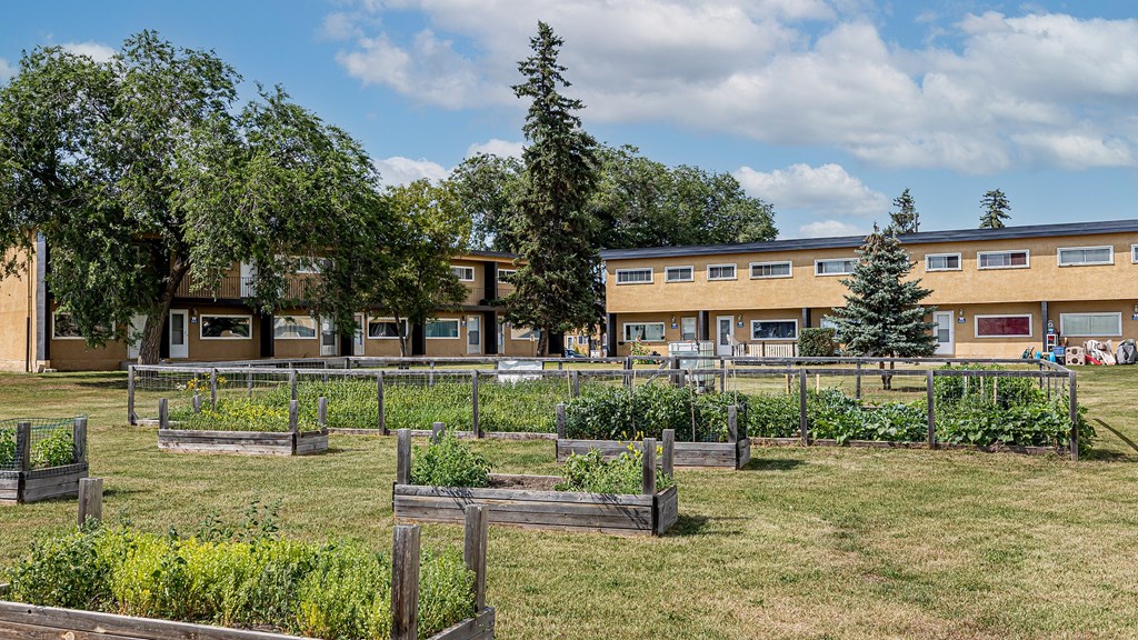 A building with a green lawn in front of it.