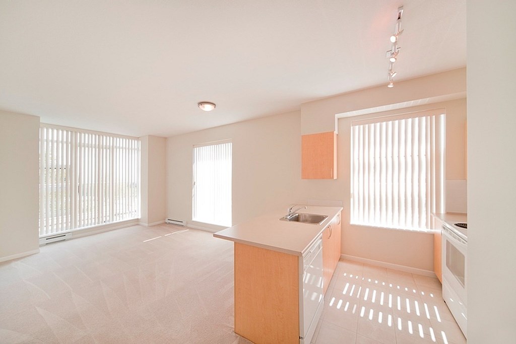 A kitchen with a sink and a window.