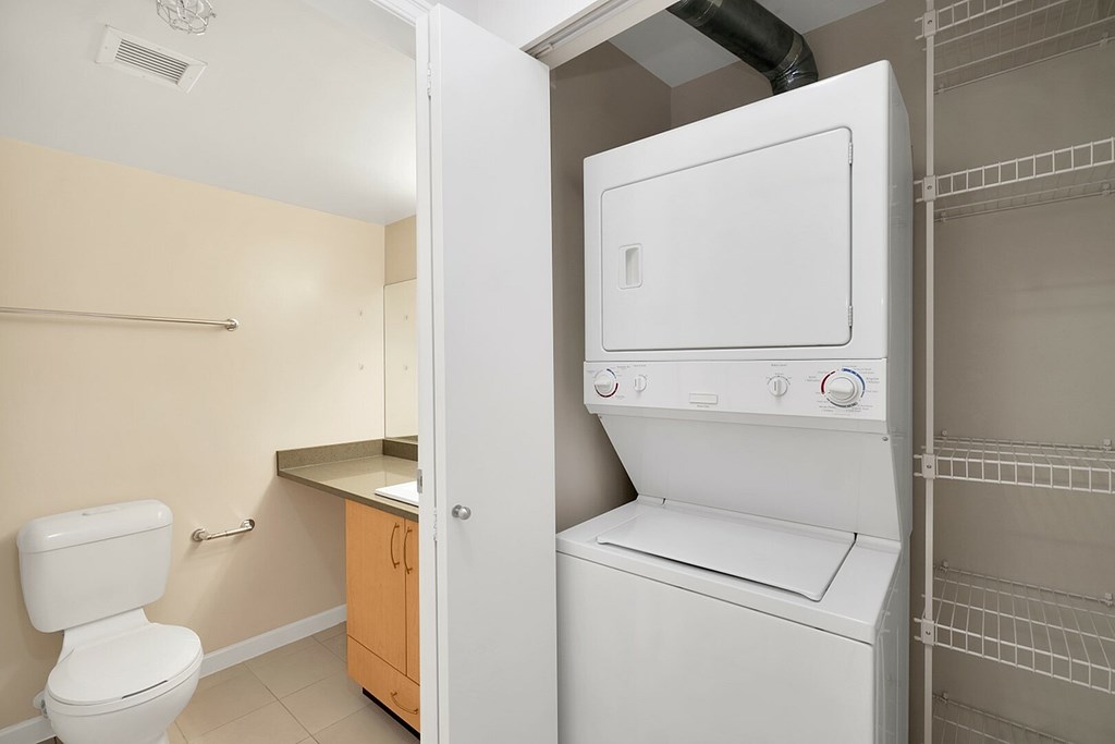 A white washer and dryer in a laundry room.
