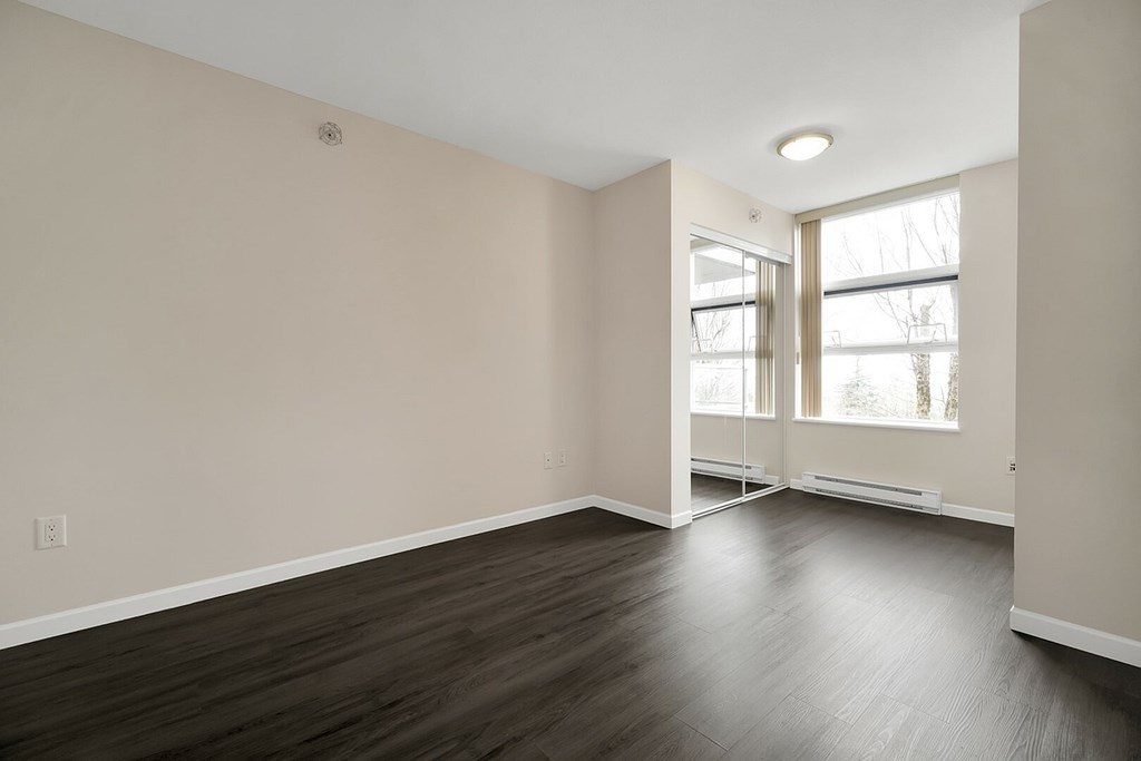 A room with a window and a door.