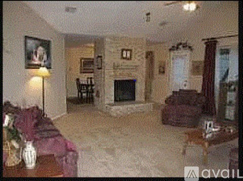 A living room with a fireplace and a couch.