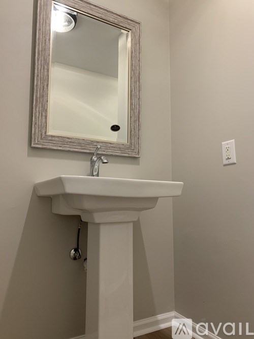 A bathroom sink with a mirror above it.