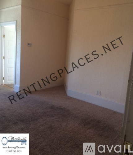 A room with a carpet floor and a wall that says RENTINGPLACES.NET.