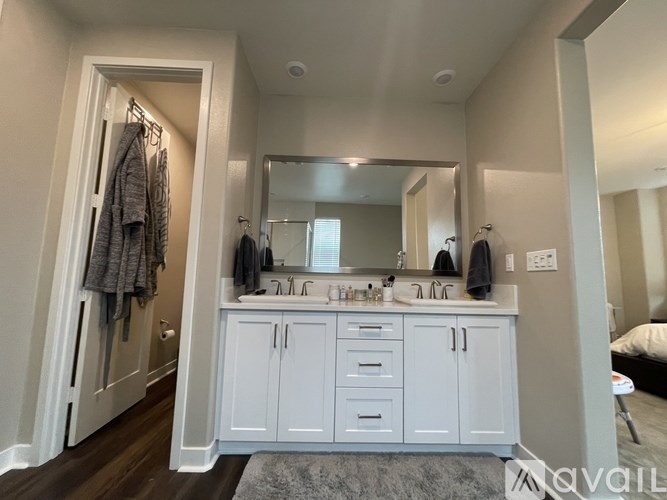 A bathroom with a vanity and a mirror.