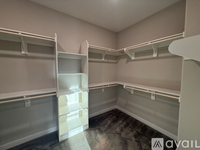 A playground with a blue slide and a white walkway.