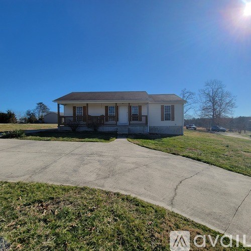A house with a driveway in front of it.