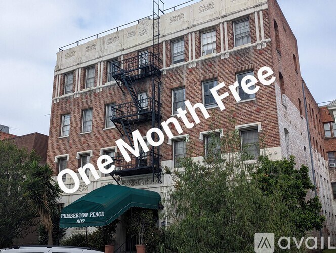 A building with a sign that says "One Month Free" in front of it.