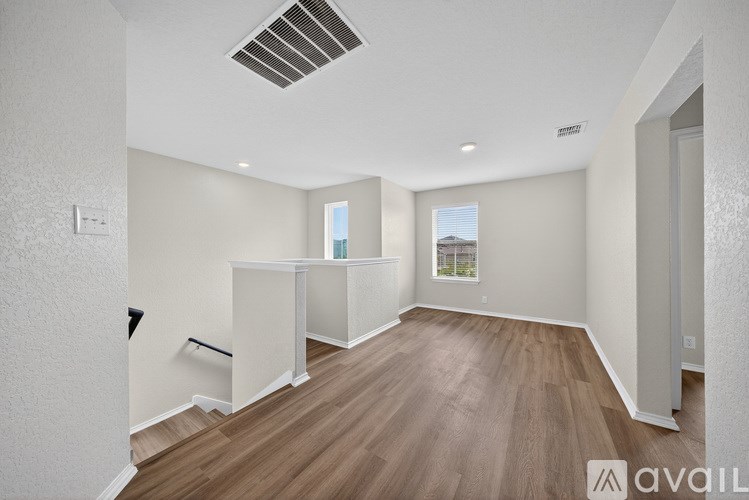 A room with a carpeted floor, a window, a dresser, and a bunk bed.