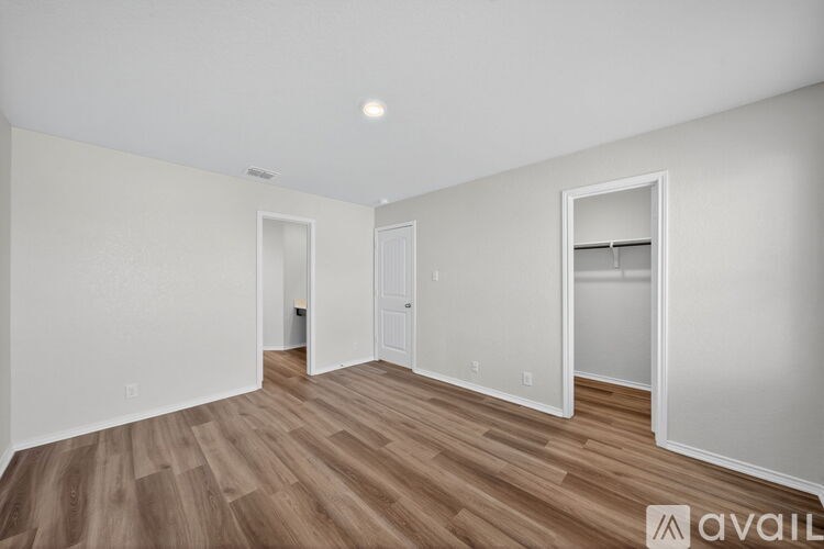 A bathroom with a white sink and a blue shower curtain.