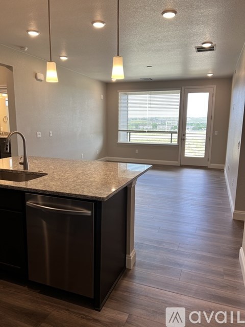 A kitchen with a sink and a window.