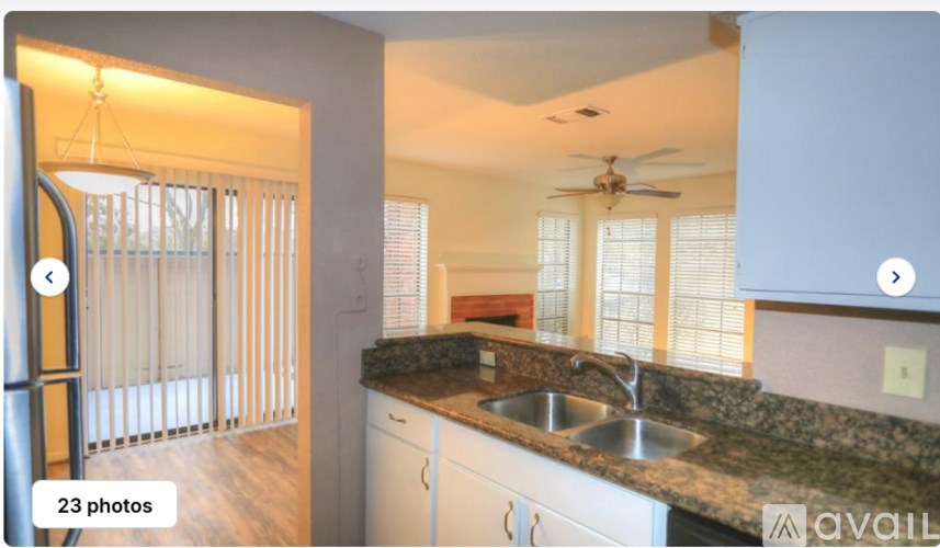 A kitchen with a sink and a window.