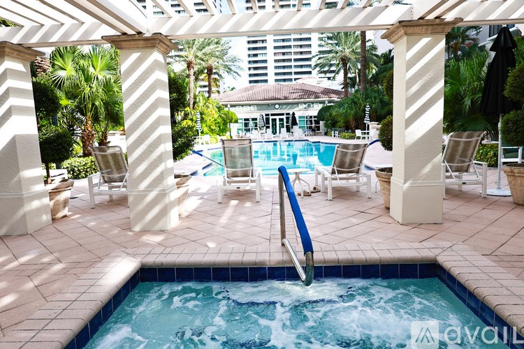 A pool with a slide in the middle of it.