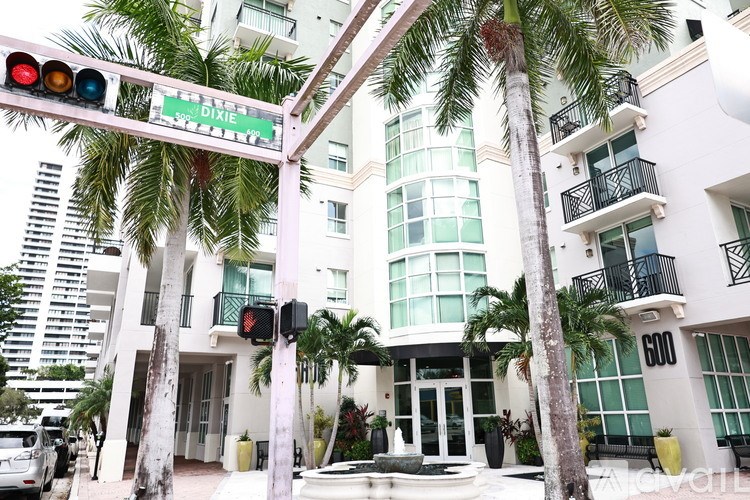 A traffic light with a green sign above it that says Dixie.