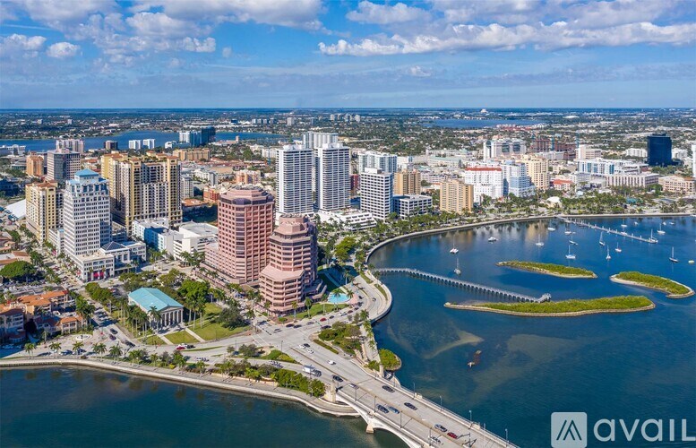 A cityscape with a body of water and a bridge.