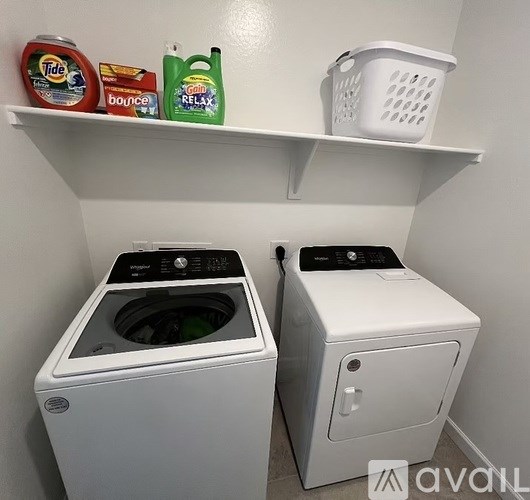 A laundry room with a washer and dryer.