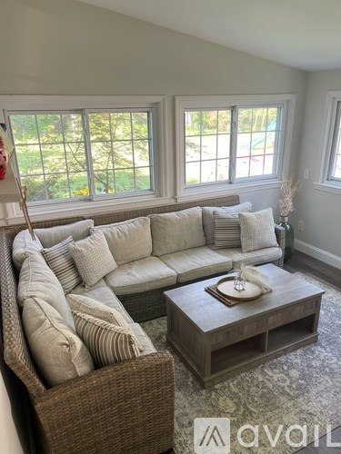 A living room with a couch and a coffee table.