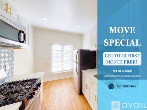 A kitchen with a stove top oven and a refrigerator.