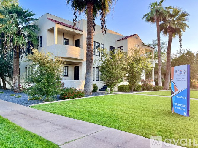 A building with a sign that says Acura in front of it.