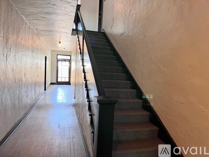 A staircase with a light at the end.