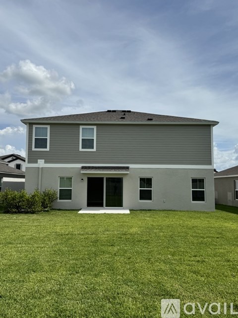 A modern house with a garage and a driveway.