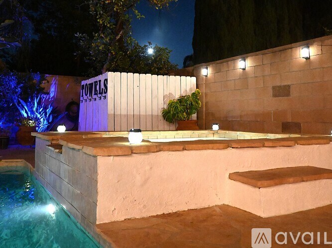 A pool with a sign that says "TOWELS" on it.