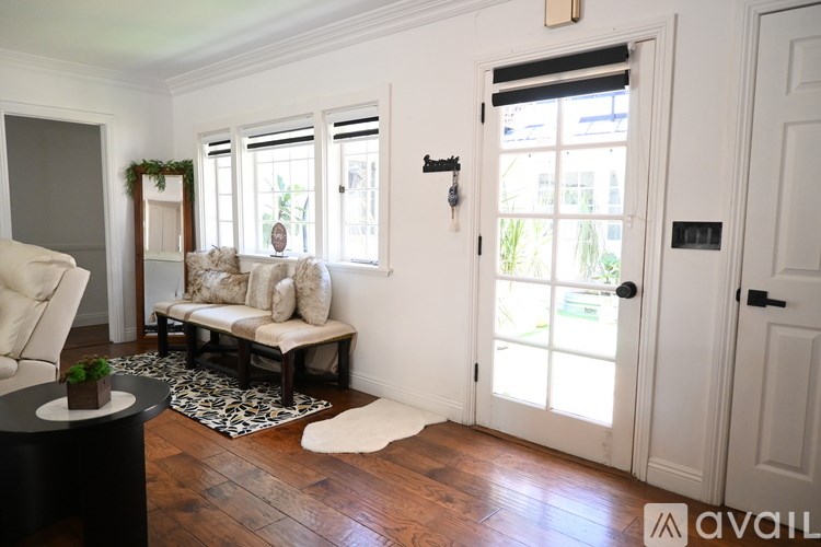 A modern kitchen with a dining table and chairs.