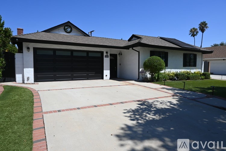 A house with a garage and a driveway.
