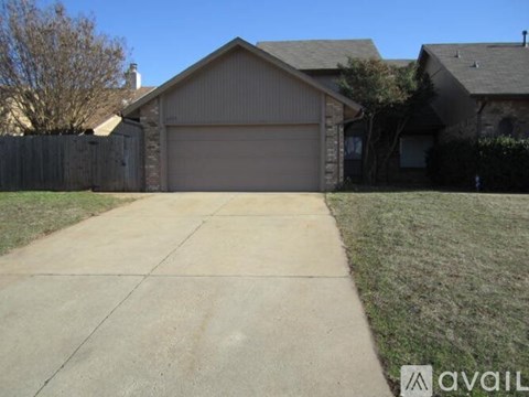 A house with a driveway in front of it.