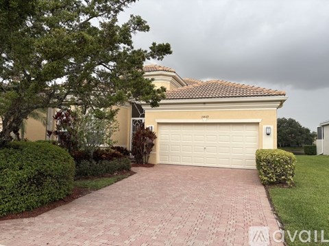 A house with a garage and a driveway.