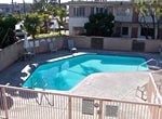 A small pool with a fence around it.