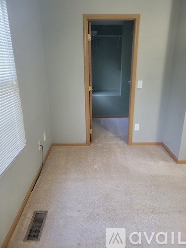 A room with a doorway leading to another room.