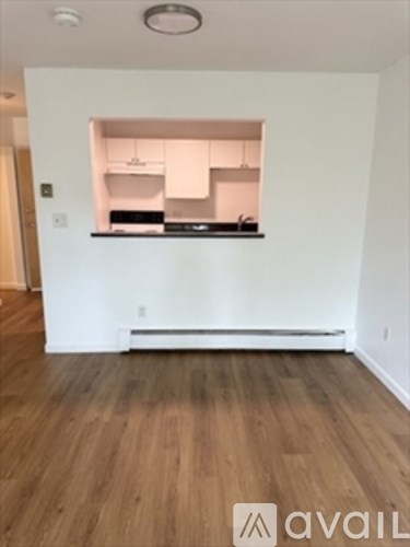 A kitchen area with a counter and a stove.