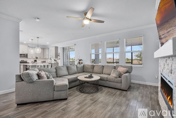 A living room with a grey sofa and a coffee table.