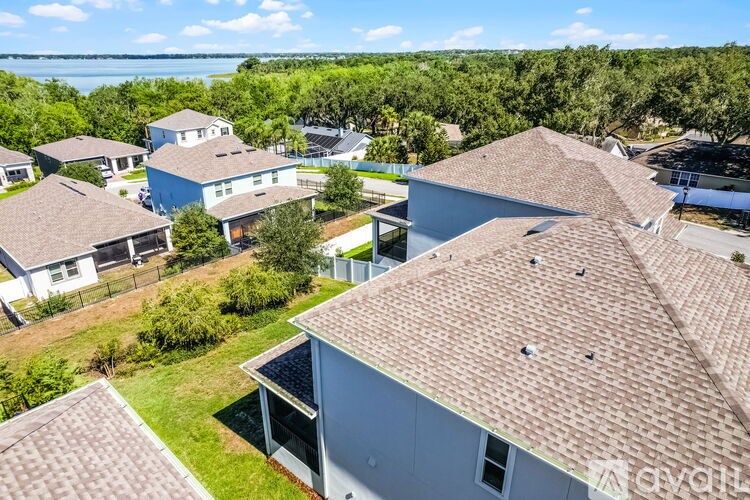 A bird's eye view of a residential area with houses and trees.