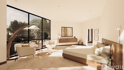 A modern bedroom with a large bed and a chair by the window.