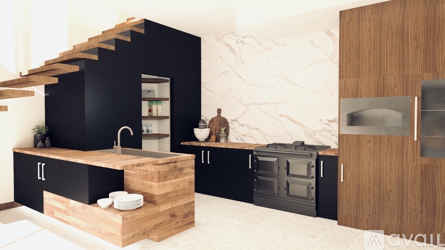 A modern kitchen with black cabinets and a wooden island.