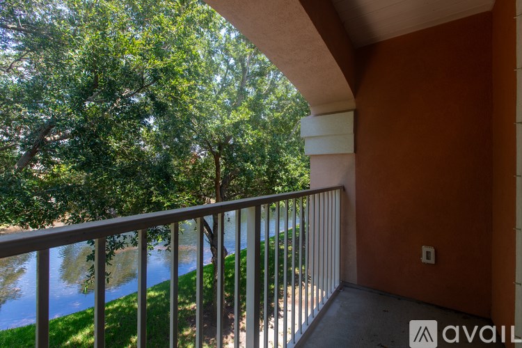 A white garage door is closed and has the number 12 on it.