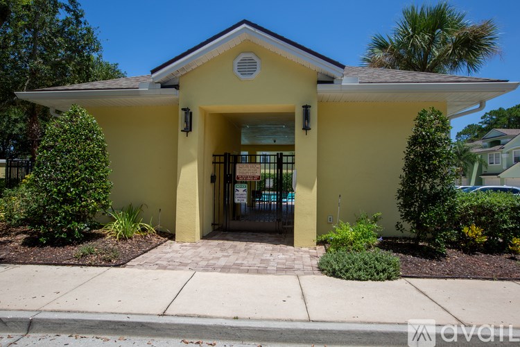 A yellow building with a black roof and a sign that says "Java Lite" on it.